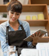Cafe owner taking orders on a tablet