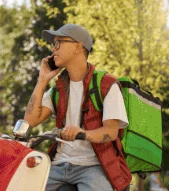Courier taking a call on the road